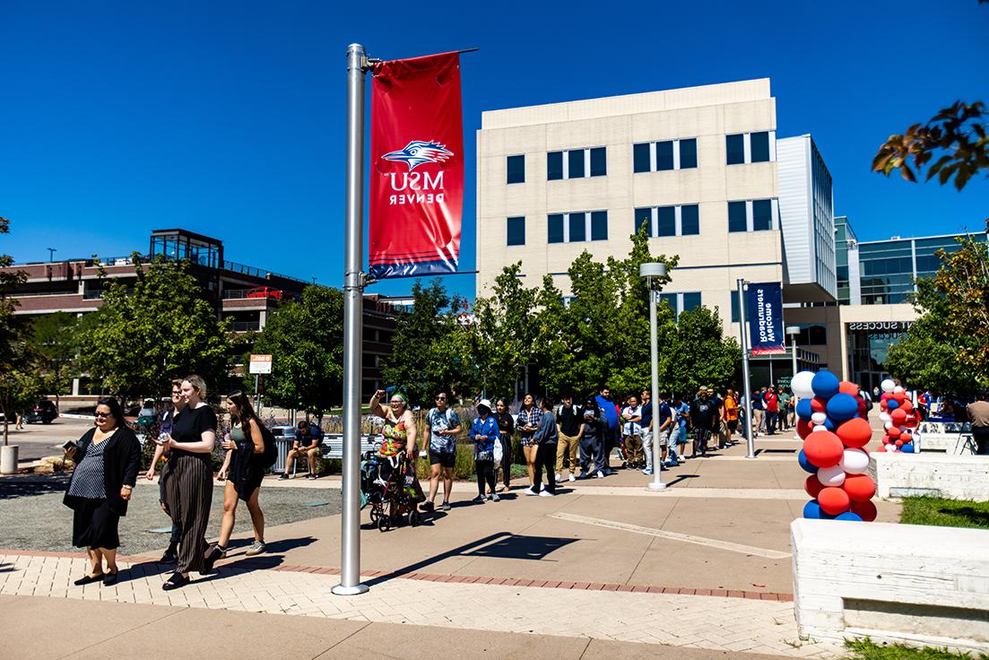 People lining up for fall fest in front of the JSSB